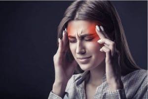Woman with headache CBD Oil for Migraines